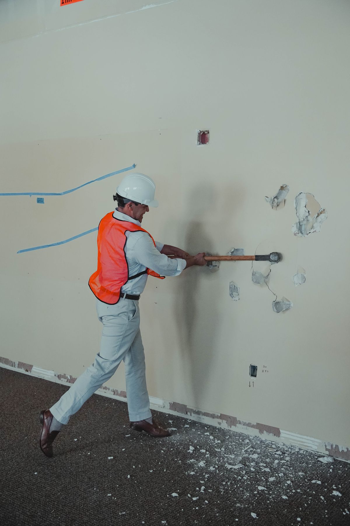 Pastor Edgar swinging the sledgehammer