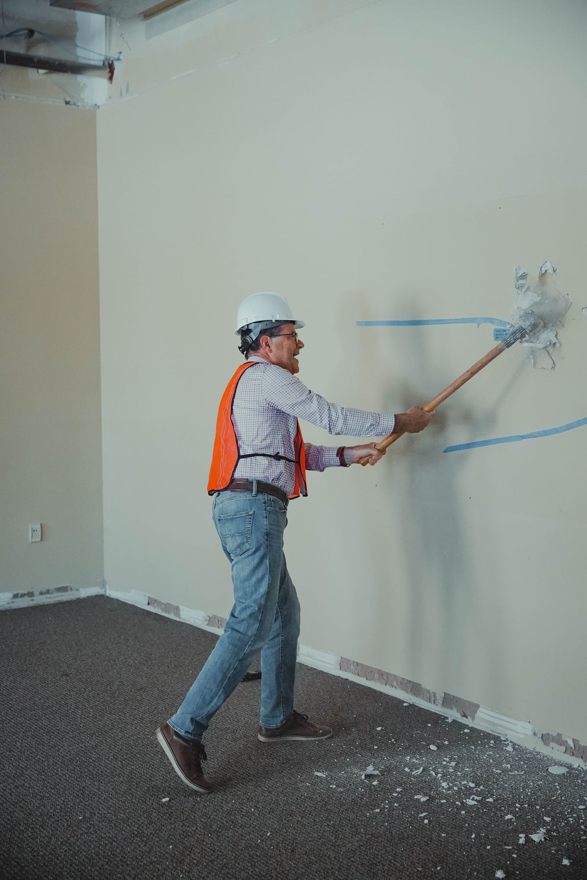 Pastor Brian breaking through drywall